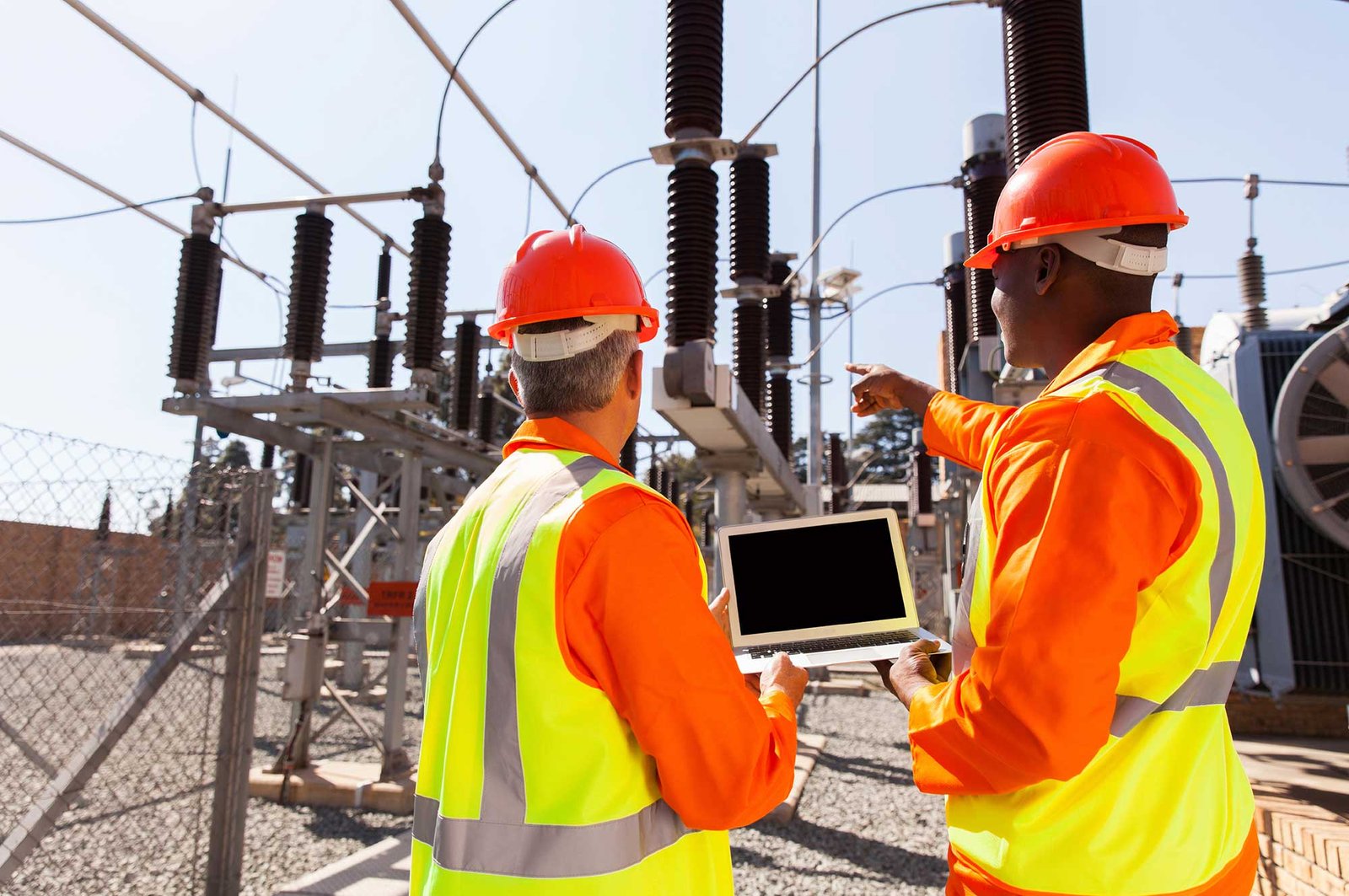 Two engineers with laptop commissioning equipment